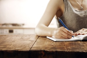 Woman Writing on Table
